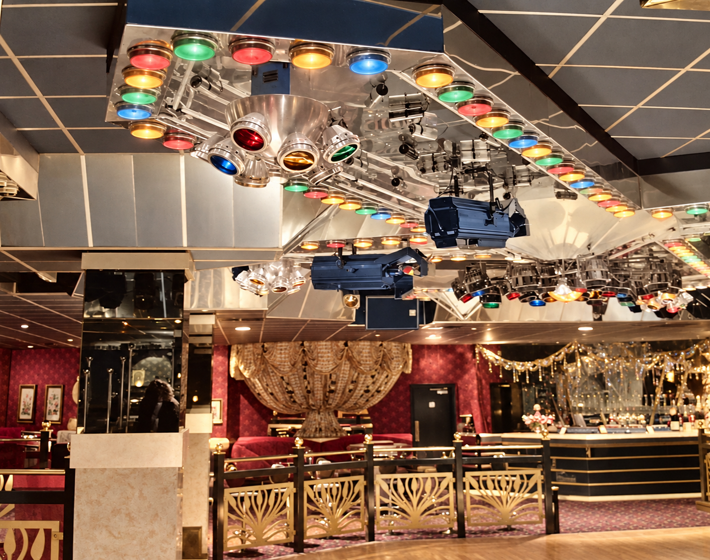 Colourised view across Cairo’s interior, with the overhead lighting gantry and speakers above the dance floor